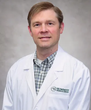 A portrait of Samuel J. Olsen II, MD.