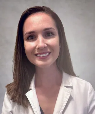 A portrait of Jenica Lamar, FNP.