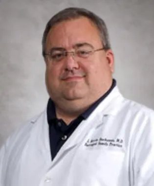 A portrait of Kevin J. Buchanan, MD.