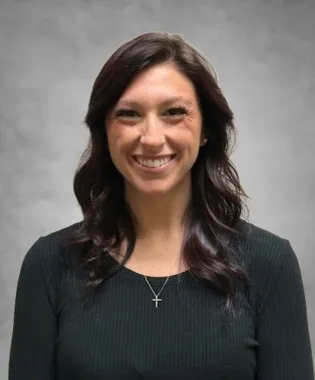 A portrait of Kaitlyn Oakley, FNP.