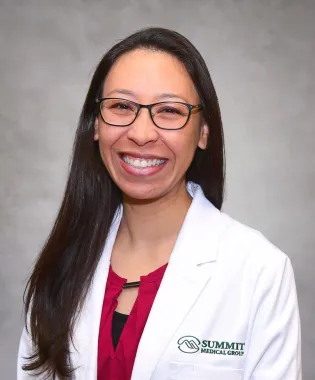 A portrait of Christina M.A. Oskins, MD.