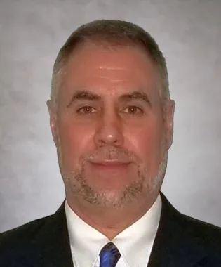 A portrait of Douglas White, FNP.