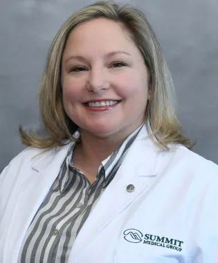 A portrait of Leeanna Copeland, RN, MSN, CPNP, PMHS.
