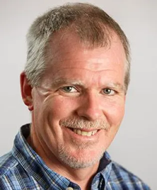 a man wearing a blue shirt.