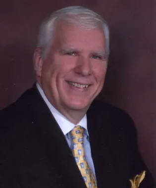 a man wearing a suit and tie.