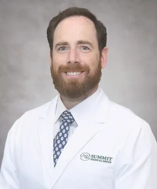 A portrait of Andrew Masters, DO.