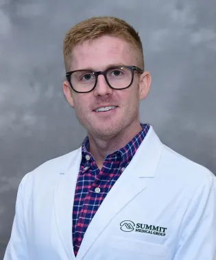 a man wearing glasses.