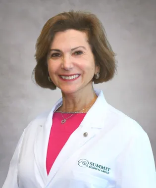 A portrait of Dina H. Mishu, MD.