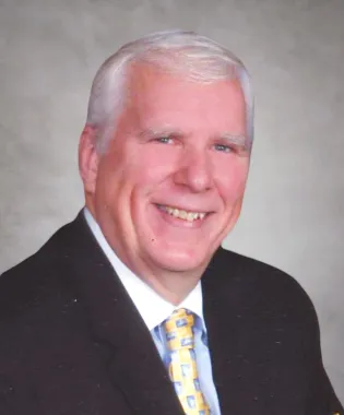 A portrait of Wayne J. Stuart, DO.