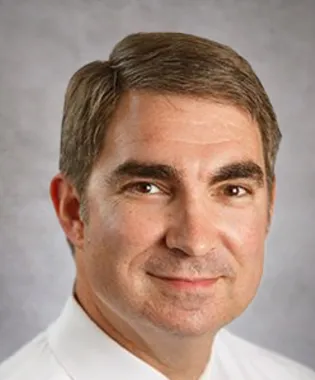 A portrait of James T. Kirby, MD.