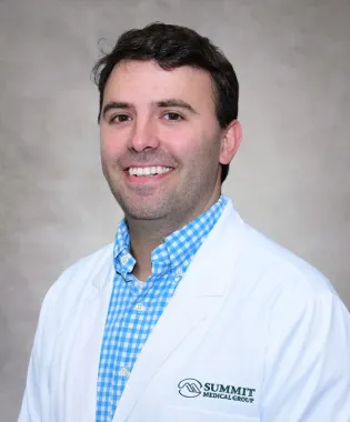 A portrait of Logan Williams, MD.