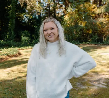 a person smiling outside