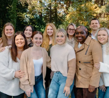 a group of people posing for a photo