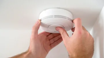 a person holding a white object