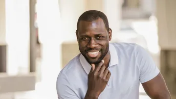 a man with his hands together