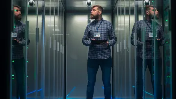 a person standing in a room with lockers