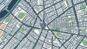 Detailed city map showing streets, blocks, parks, and a central roundabout with radiating roads.