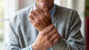 a man holding his wrist