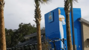 a blue building with a blue sign