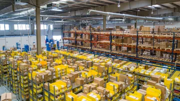 a store with shelves of yellow containers