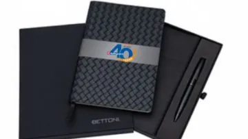 Black woven notebook with 40th anniversary band, black pen, and black Bettoni notebook gift set