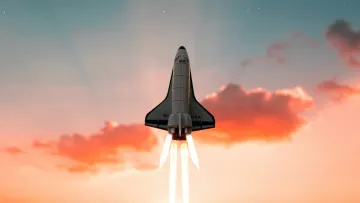Space shuttle launching with fiery propulsion against a sunset sky and starry night with a shooting star.