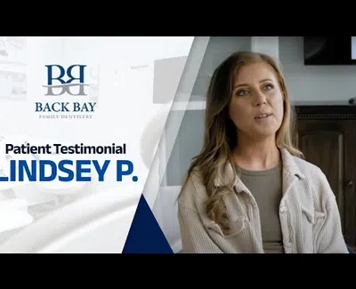 Patient testimonial by Lindsey P. featured by Back Bay Family Dentistry with logo and modern design.