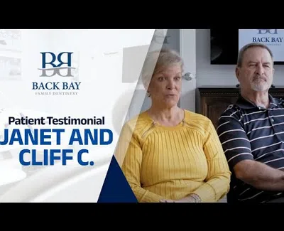 Janet and Cliff C. share a patient testimonial at Back Bay Family Dentistry with logo and text overlay.