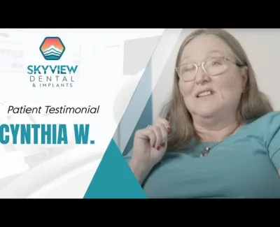 Patient testimonial from Cynthia W. at Skyview Dental & Implants, woman smiling and speaking.