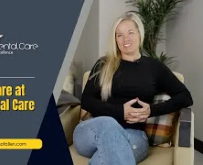 Smiling woman seated on a chair sharing her positive experience with Advanced Dental Care of Allen.