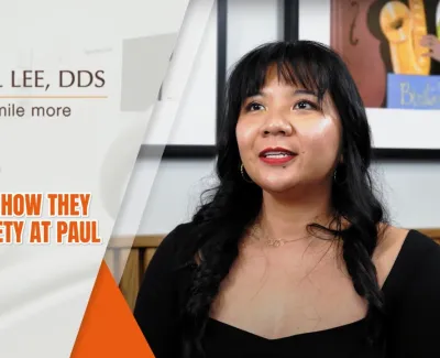 Patient testimonial video still of a woman sharing how Paul Lee DDS relieved her dental anxiety.
