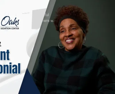 Smiling woman giving a patient testimonial for The Implant Center at North Oaks Dental