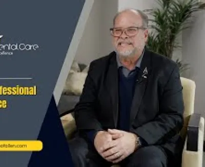 Smiling man in black suit sitting beside Advanced Dental Care ad promoting genuine professional dental practice care.