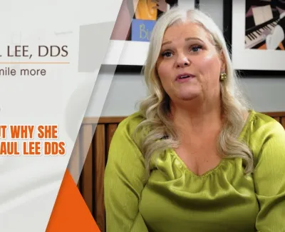 Patient Kristie shares her positive testimonial about Paul Lee DDS dental care in a bright office setting.