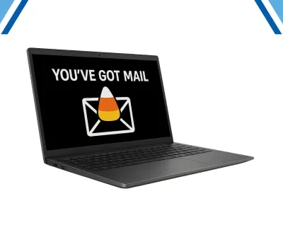 Black laptop with screen displaying Youve Got Mail message and candy corn icon on white background.