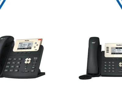Two black Yealink desk phones with LCD screens and multiple buttons on a white background with blue corner accents.