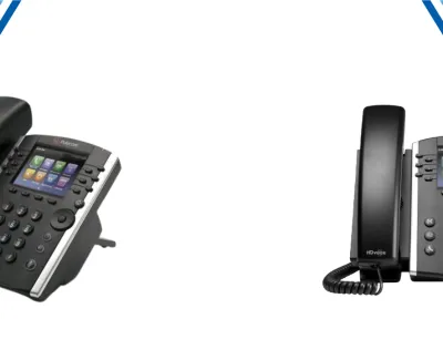 Two black Polycom office desk phones with color display screens and multiple buttons isolated on white background