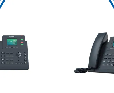 Two Yealink office IP phones with color display screens showing time and call information on a white background.