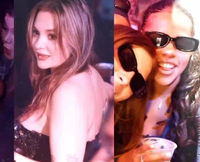 Three young women enjoying a night out, posing, dancing, and smiling with vibrant club lighting.