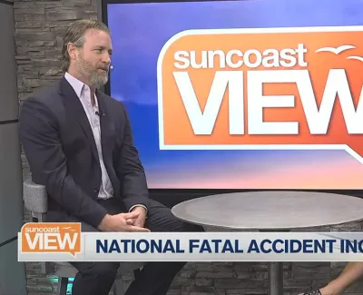 Two news anchors discuss national fatal accident increase on Suncoast View set with logo and temperature visible.
