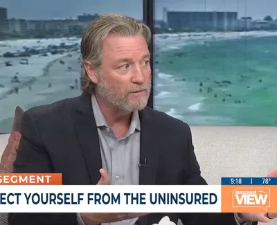 Man in blazer speaking on a TV show segment with overlaid text reading Protect Yourself from the Uninsured.