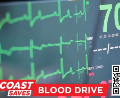 Heart monitor showing a pulse rate of 70 during a Suncoast Saves Blood Drive with QR code visible.