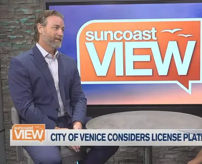Two hosts discussing City of Venice license plate readers on Suncoast View TV show set.