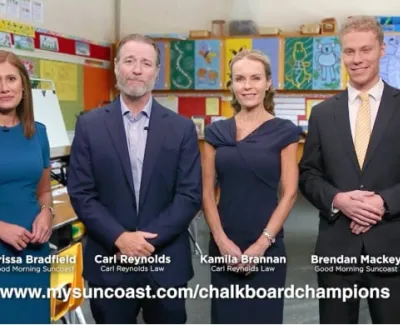 Four professionals standing in a colorful classroom promoting Chalkboard Champions on MySuncoast.com