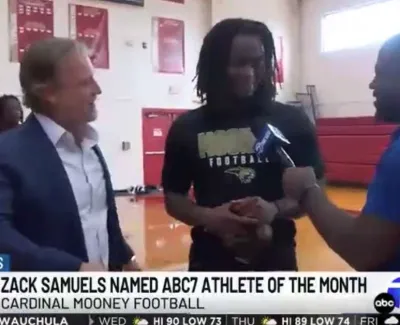 Zack Samuels named ABC7 Athlete of the Month in a gym interview with reporters and teammates.