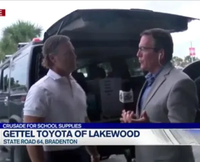 Live broadcast interview at Gettel Toyota of Lakewood with two men discussing school supplies event.