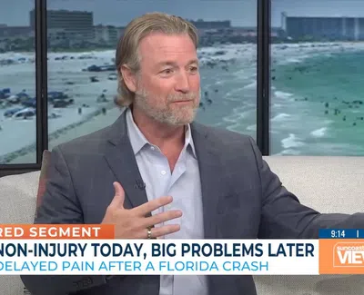 Man in gray blazer speaking on a talk show with overlaid text about delayed pain after a Florida car crash