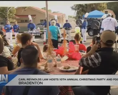 Hundreds Attend Carl Reynolds Law's Christmas Party and Food Drive