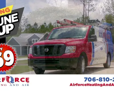 Red Airforce heating and air service truck with spring tune-up promotion for $69 and contact info.