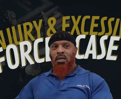 Man with red beard and black headwrap in blue shirt with injury and excessive force case text background.